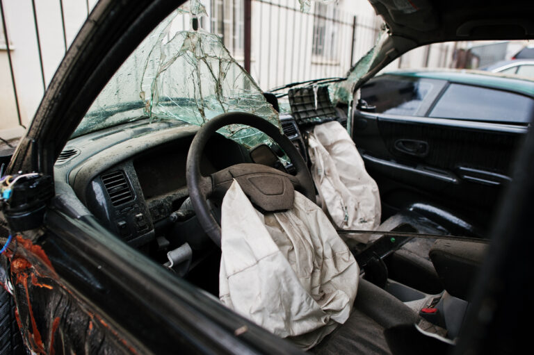 car-after-accident-car-interior-with-airbag-after-crash-scaled